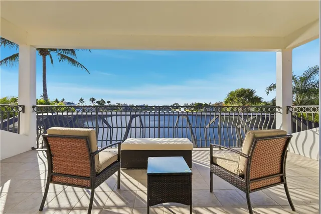 a view of a balcony with furniture