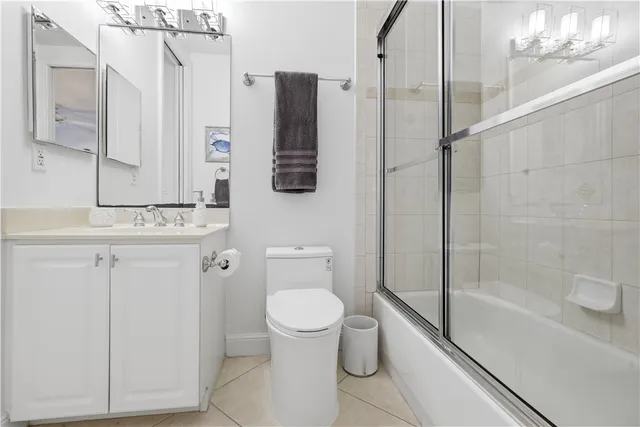 a bathroom with a toilet sink and shower