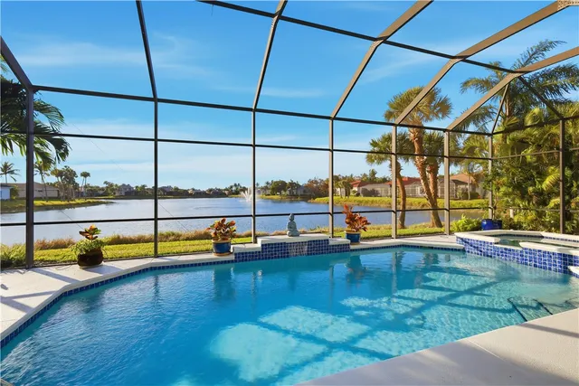 a view of a swimming pool with a lounge chair