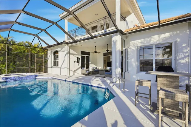 a view of a patio with dining table and chairs