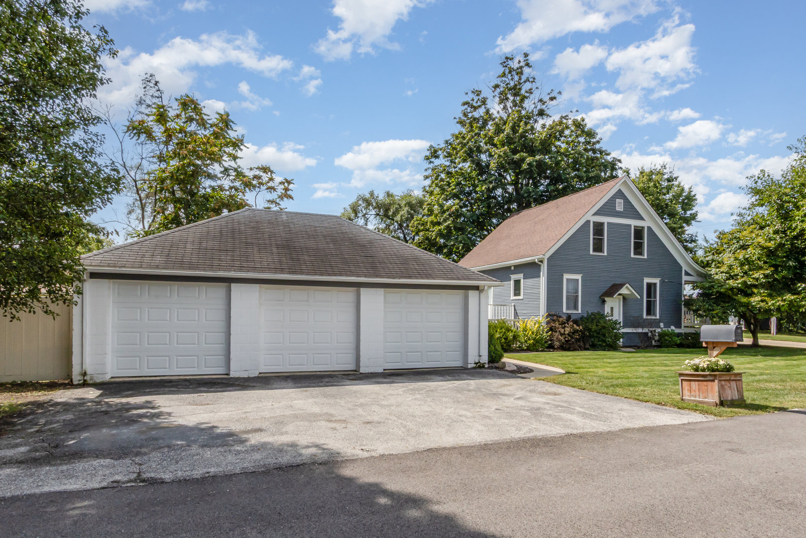 19429 Wolf Road Mokena, IL 60448 - Photo 17 of 18 a front view of a house with a yard and garage