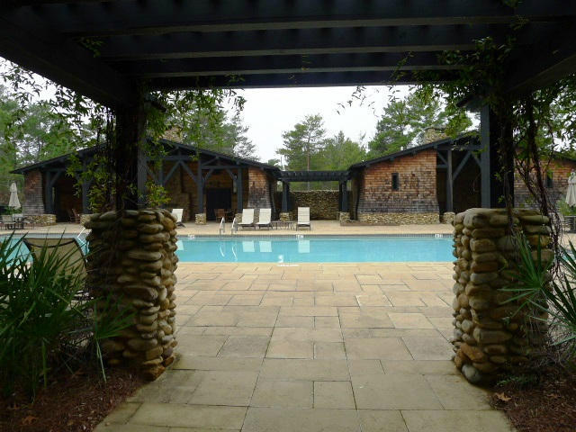 Lot 1-bk West Cedar Bend Road Santa Rosa Beach, FL 32459 - Photo 1 of 7 a view of a backyard with table and chairs potted plants and a large tree