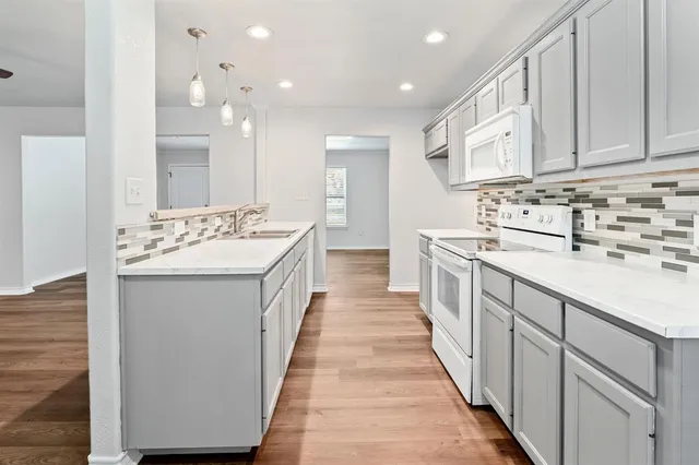 a bathroom with a sink a mirror and a bathtub