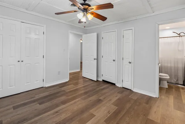 a view of an empty room and wooden floor
