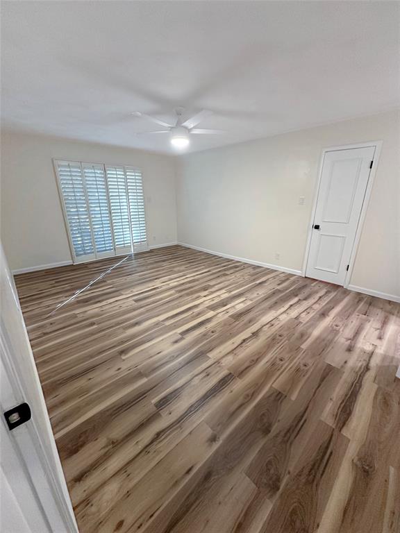 2301 Ridgmar Plaza, Unit 5 Fort Worth, TX 76116 - Photo 13 of 20 Spare room with light wood finished floors and a ceiling fan