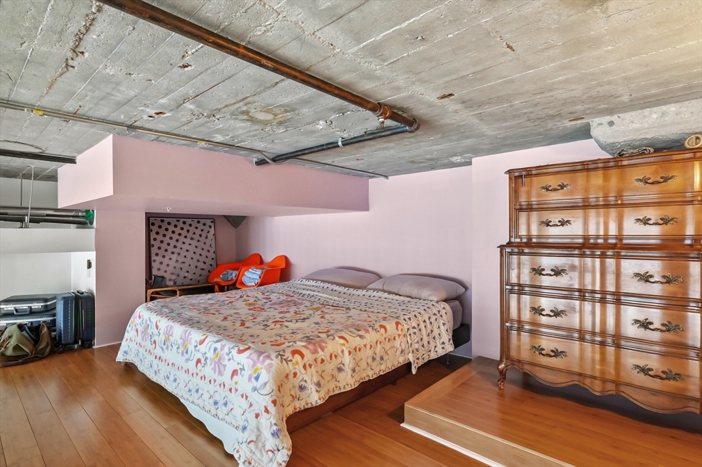 156 Porter Street, Unit 246 Boston, MA 02128 - Photo 14 of 25 a bedroom with a bed and a closet