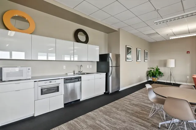 a kitchen with a table and chairs