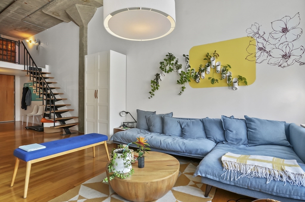 156 Porter Street, Unit 246 Boston, MA 02128 - Photo 8 of 25 a living room with furniture and a potted plant