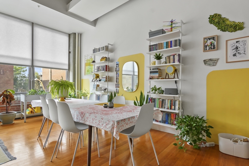 156 Porter Street, Unit 246 Boston, MA 02128 - Photo 10 of 25 a view of a dining room with furniture and a potted plant