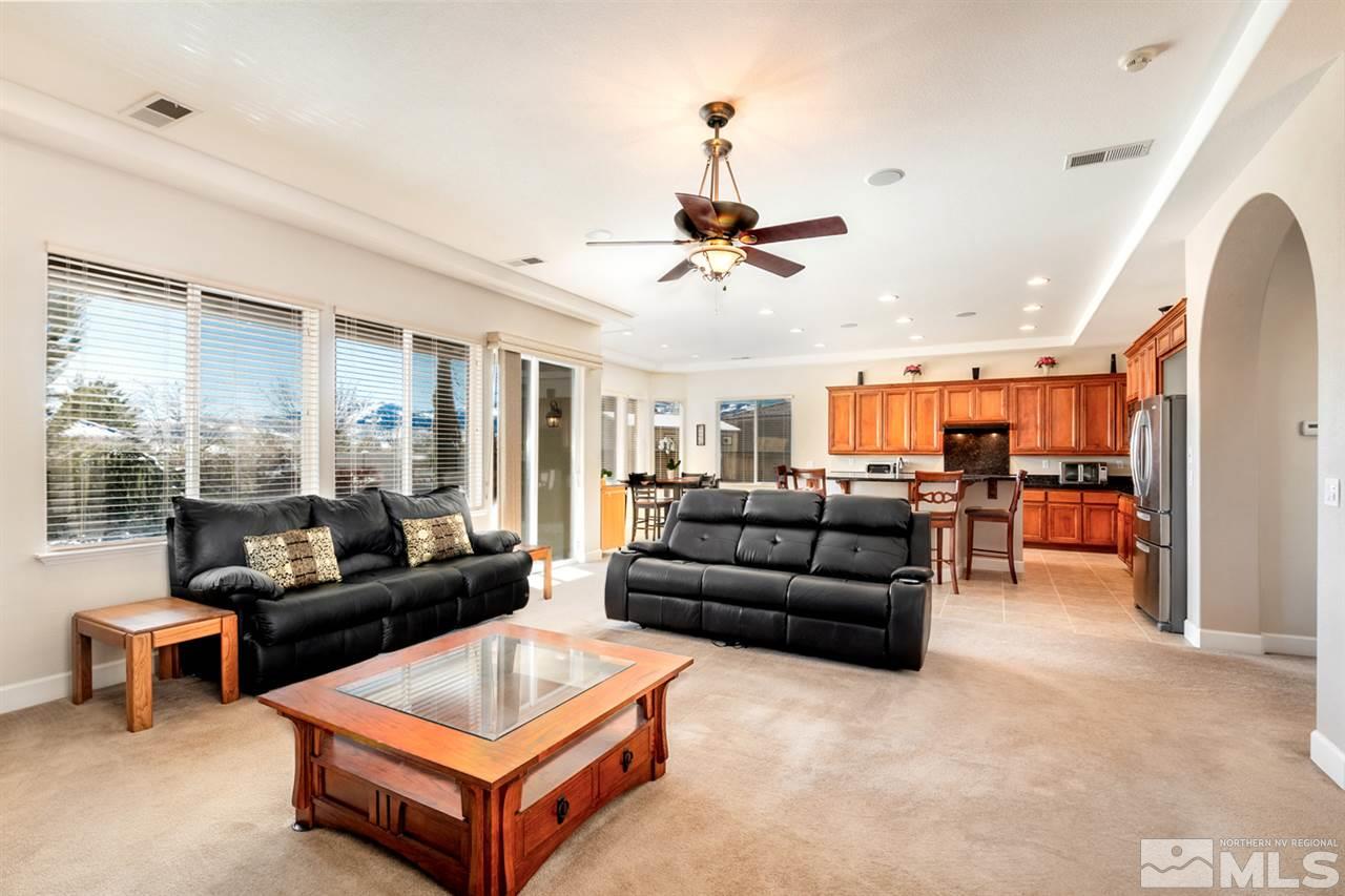 2630 Fury Court Reno, NV 89521 - Photo 11 of 25 a living room with furniture and a chandelier