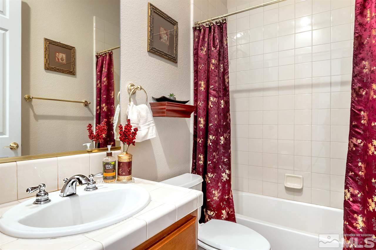 2630 Fury Court Reno, NV 89521 - Photo 22 of 25 a bathroom with a sink toilet and shower