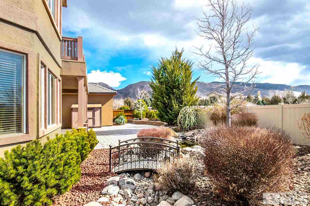 2630 Fury Court Reno, NV 89521 - Photo 24 of 25 a view of a lake with a house in the background