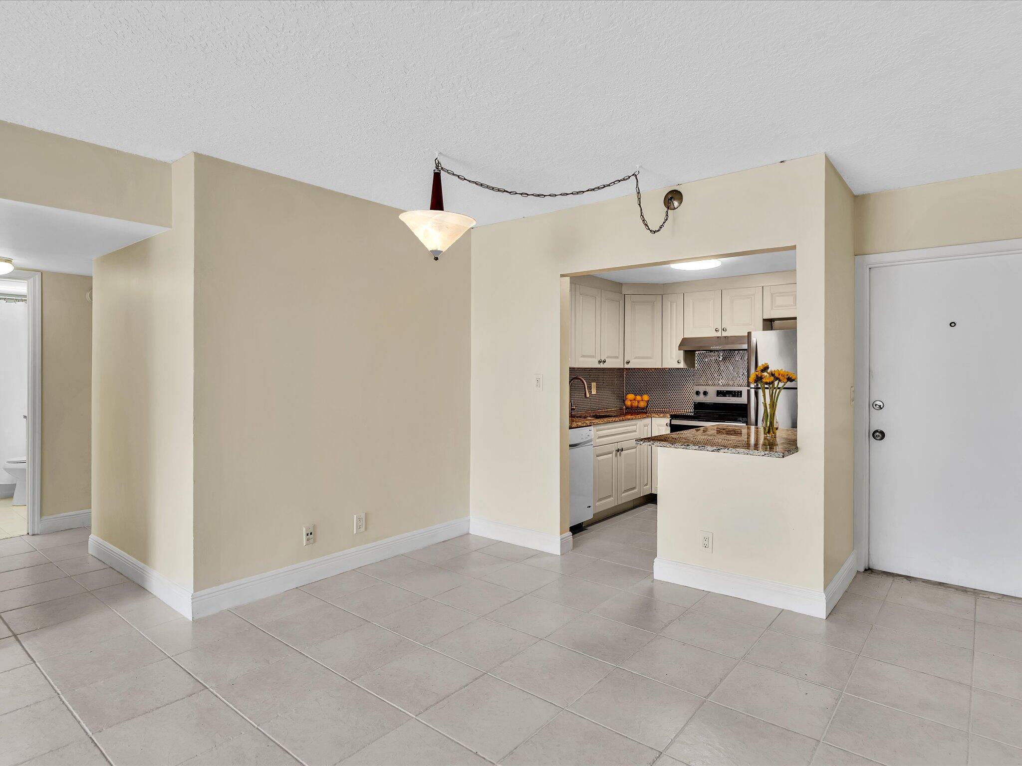 644 Northwest 13th Street, Unit 160 Boca Raton, FL 33486 - Photo 8 of 54 Entrance Kitchen Dining