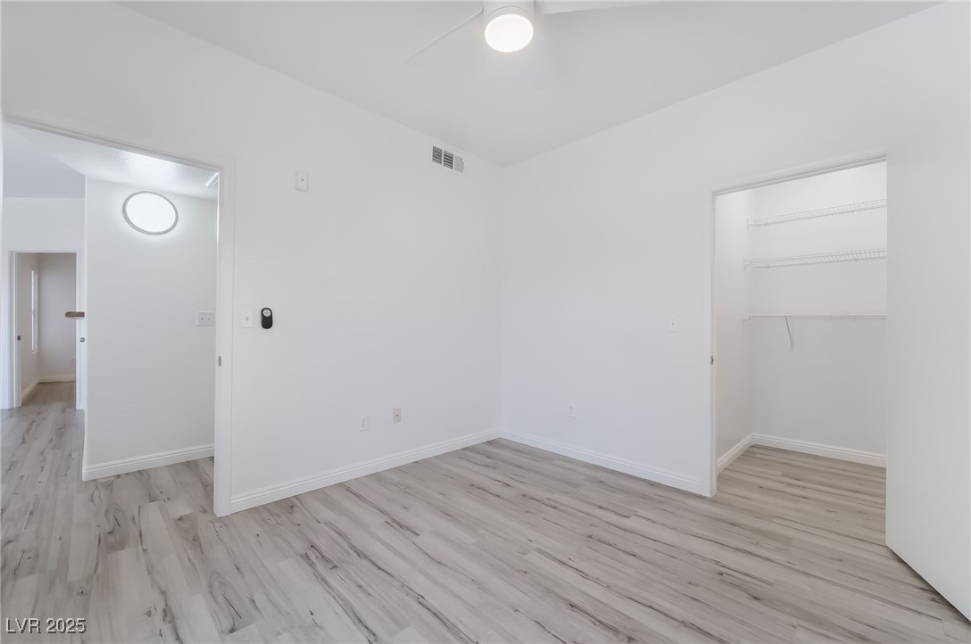 7255 West Sunset Road, Unit 1148 Las Vegas, NV 89113 - Photo 29 of 62 Spare room with a ceiling fan and light wood-style flooring