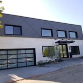 a front view of a house with a garage