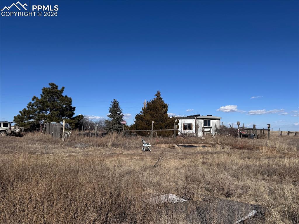 32775 Truckton Road Yoder, CO 80864 - Photo 6 of 15 a view of a dry yard with trees