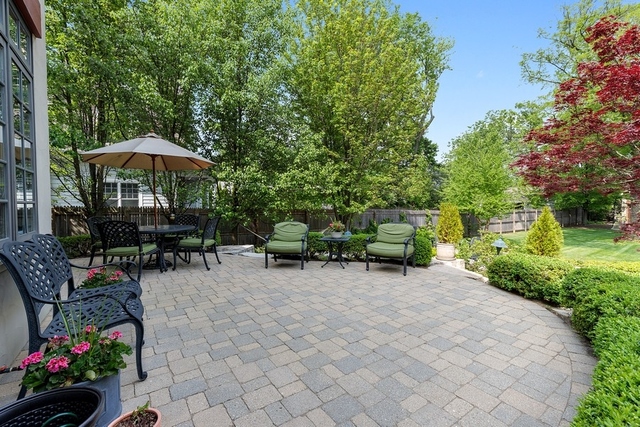 1351 Edgewood Road Lake Forest, IL 60045 - Photo 22 of 30 a view of a backyard with furniture and a garden