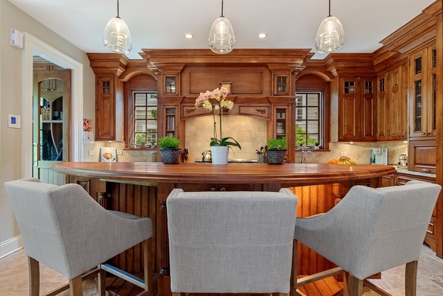 1351 Edgewood Road Lake Forest, IL 60045 - Photo 5 of 30 a dining hall with a dining table and chairs with wooden floor