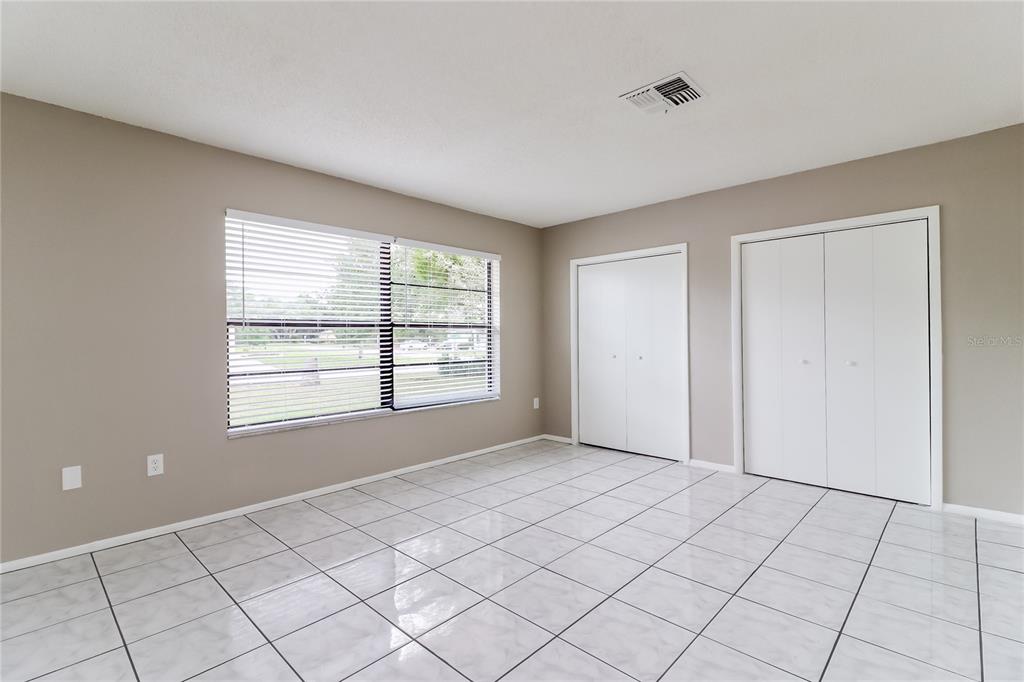 Undisclosed Address Spring Hill, FL 34609 - Photo 3 of 15 a view of an empty room with window