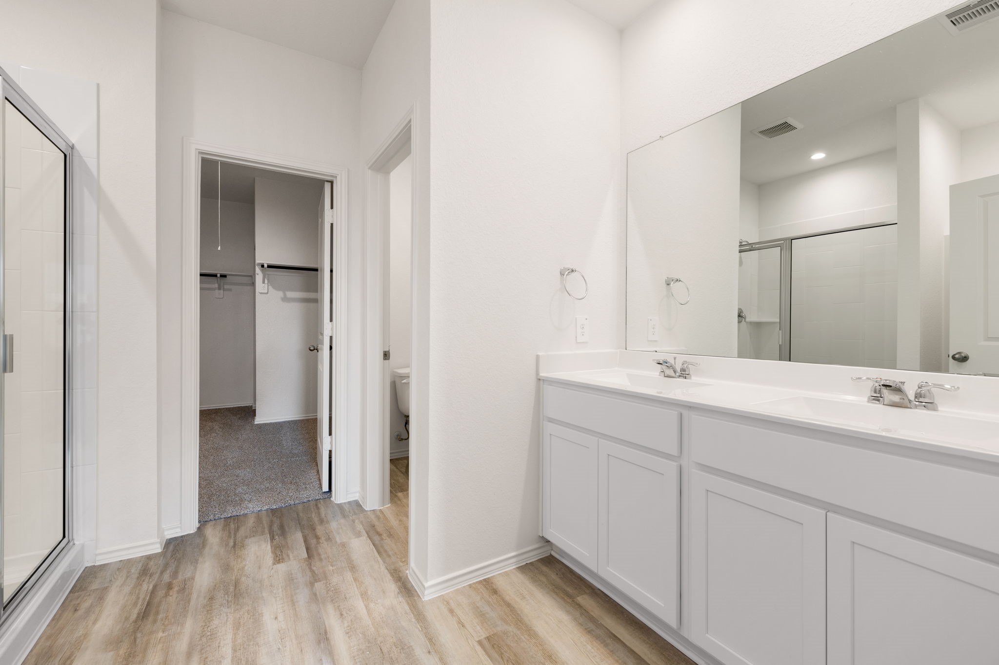 31007 Delamere Fulshear, TX 77441 - Photo 8 of 22 a bathroom with a double vanity sink and mirror