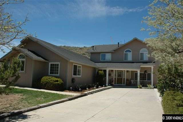 10 Connie Way Reno, NV 89521 - Photo 1 of 1 a front view of a house with garden