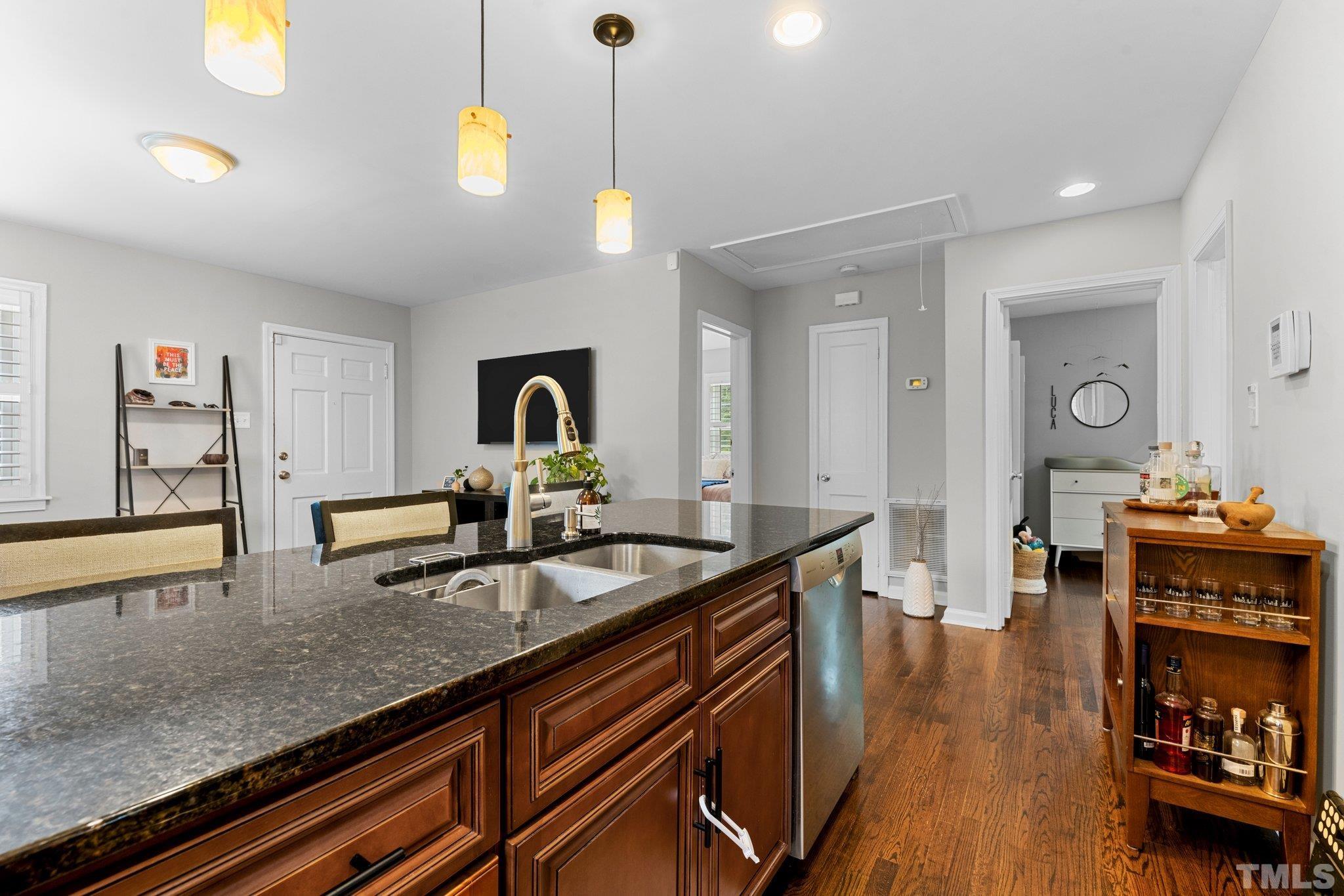 1212 Gatling Street Raleigh, NC 27610 - Photo 8 of 15 a kitchen with sink stove and cabinets