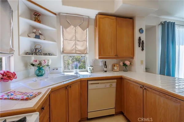 a kitchen with a stove and a refrigerator