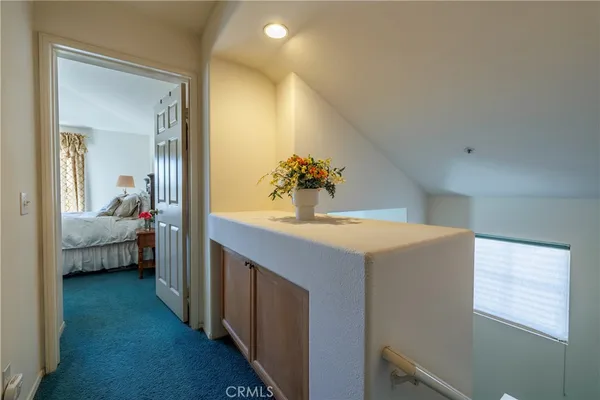 a bedroom with bed and window