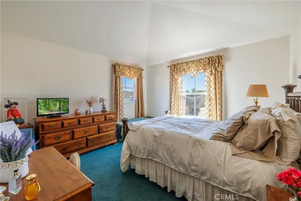 a bedroom with a bed and furniture