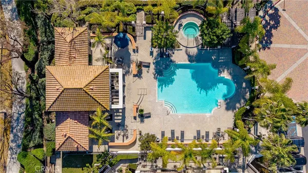 an aerial view of residential building with parking