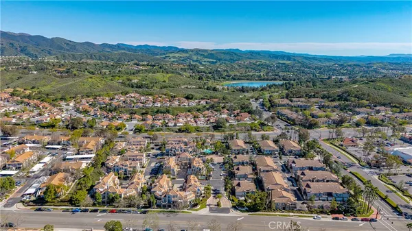 an aerial view of residential houses with outdoor space