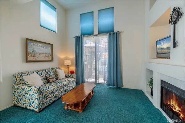 a view of balcony with furniture and garden