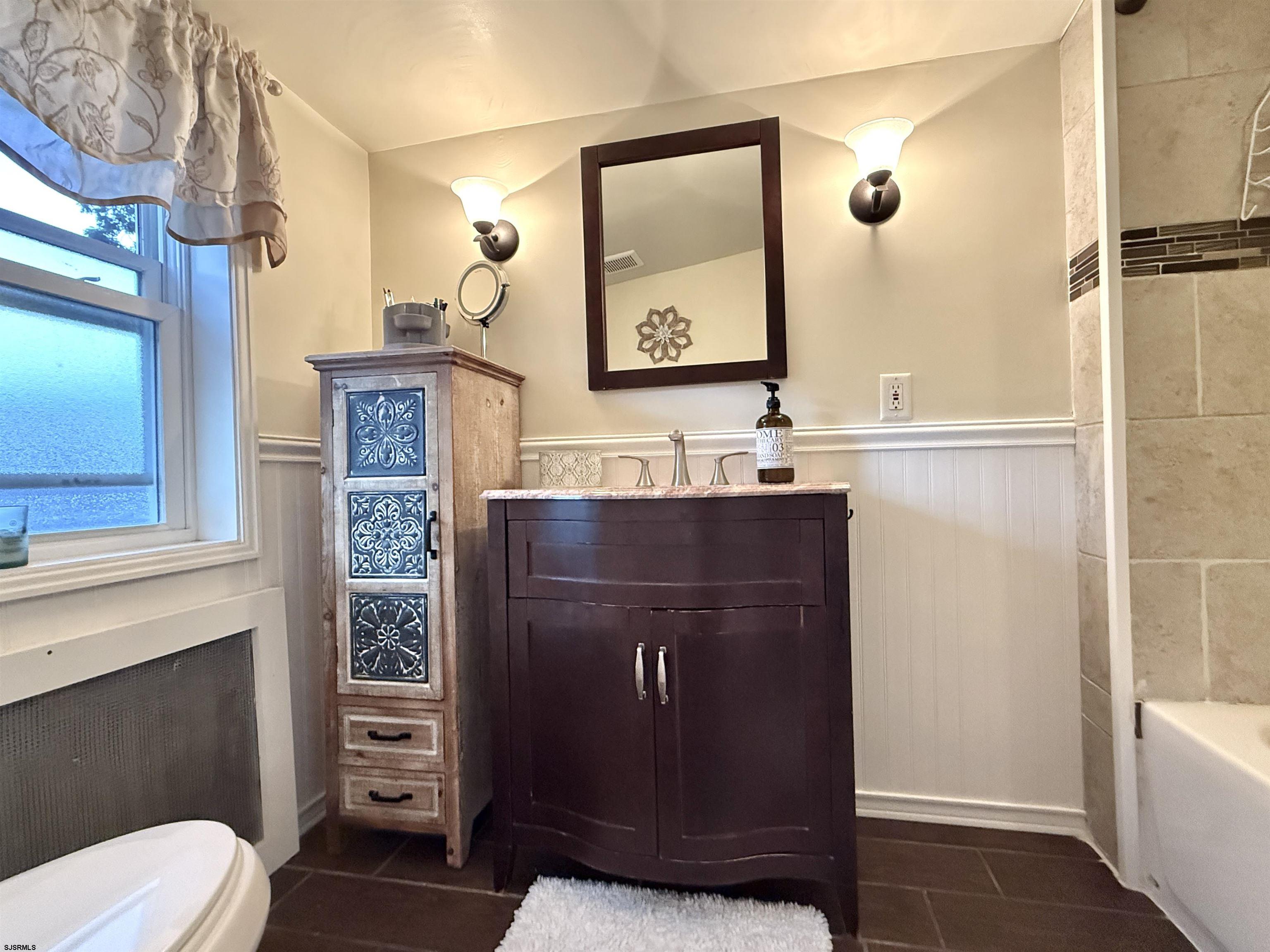 605 Shore Road Linwood, NJ 08221 - Photo 44 of 99 a bathroom with a sink a toilet and shower