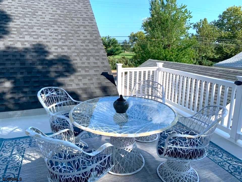 605 Shore Road Linwood, NJ 08221 - Photo 64 of 99 a balcony with table and chairs