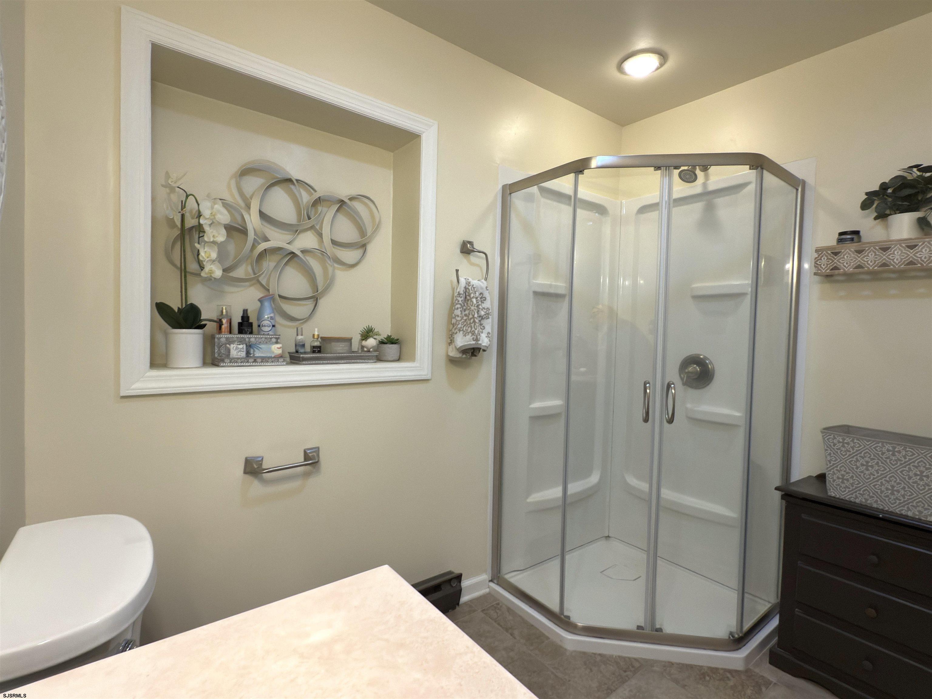 605 Shore Road Linwood, NJ 08221 - Photo 81 of 99 a bathroom with a shower and toilet