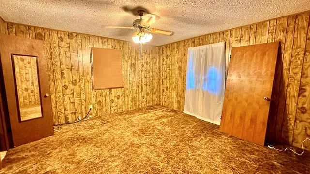 a view of a bathroom with shower and a window