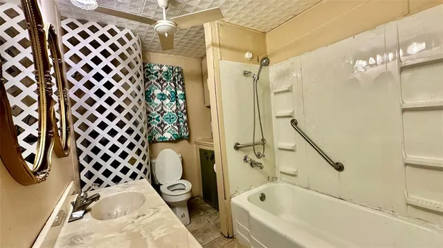 a bathroom with a bathtub and shower