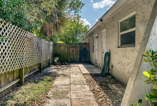 a view of a backyard of the house