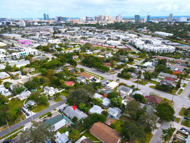 an aerial view of residential houses with outdoor space