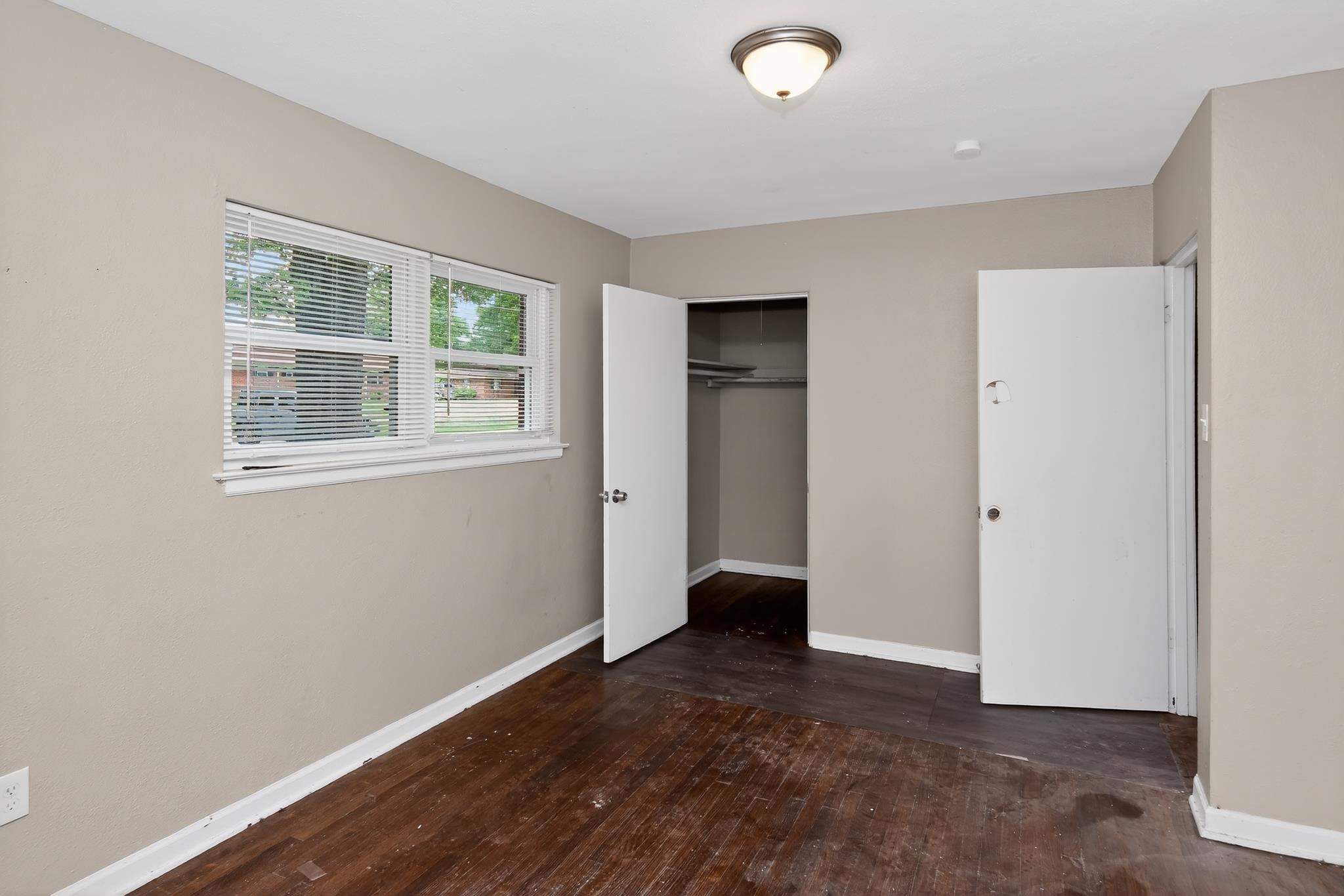 1403 Old Hickory Road Memphis, TN 38116 - Photo 19 of 31 Room with wood-finish flooring and neutral painted walls