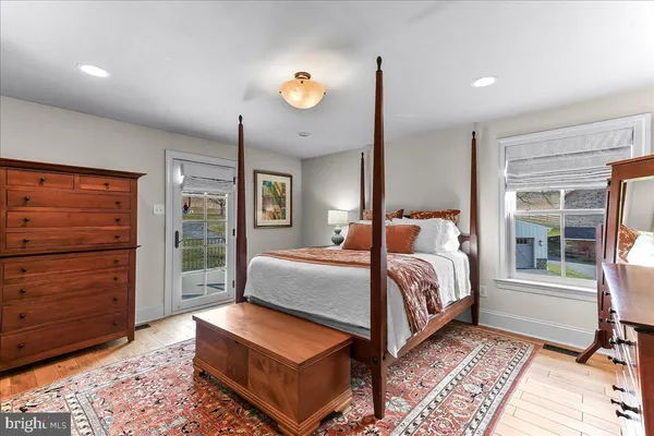 a bedroom with furniture and a window
