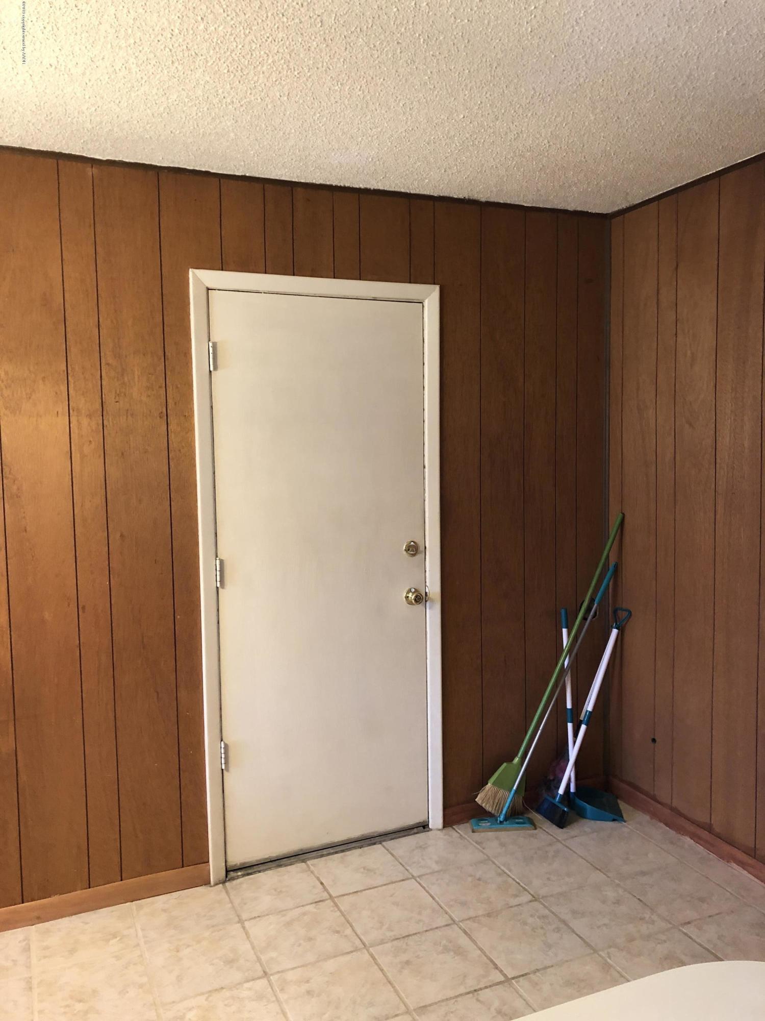 2409 Darrell Avenue Amarillo, TX 79110 - Photo 17 of 26 dining door to garage