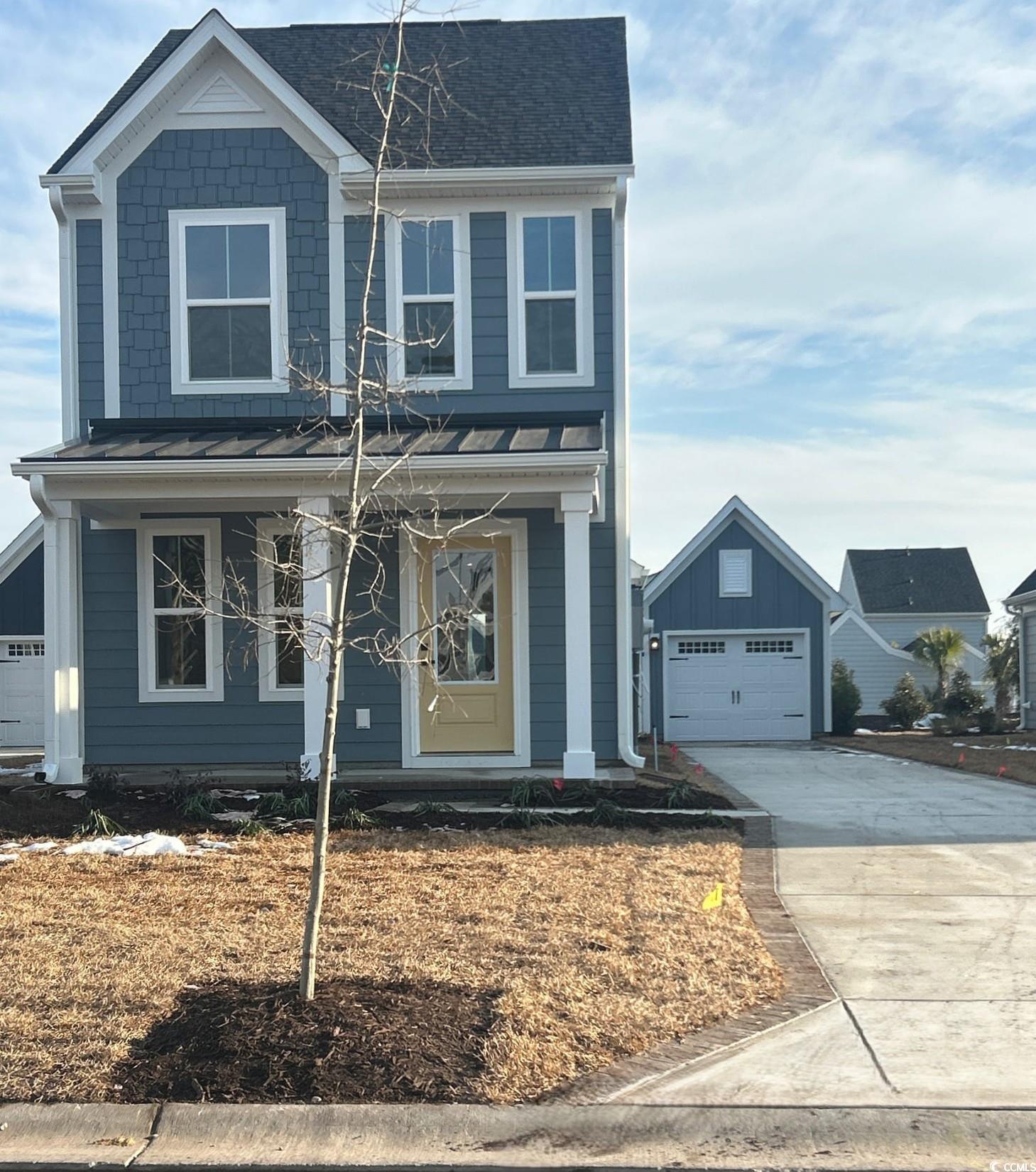 2760 Rowyn Street Longs, SC 29568 - Photo 1 of 16 View of front facade with a front lawn, a garage, and an outdoor structure