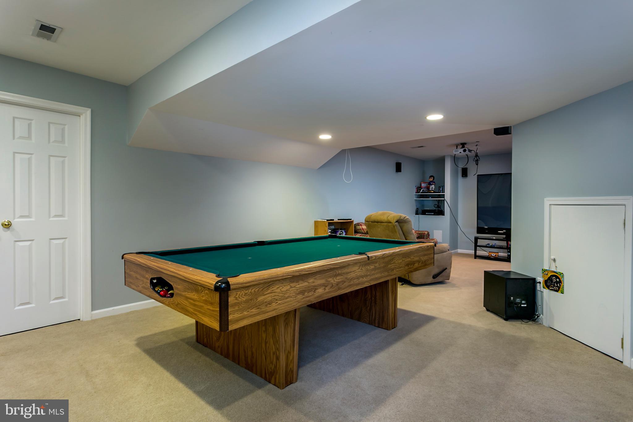 13 Johnson Road Pasadena, MD 21122 - Photo 16 of 28 Pool table, projector and screen convey