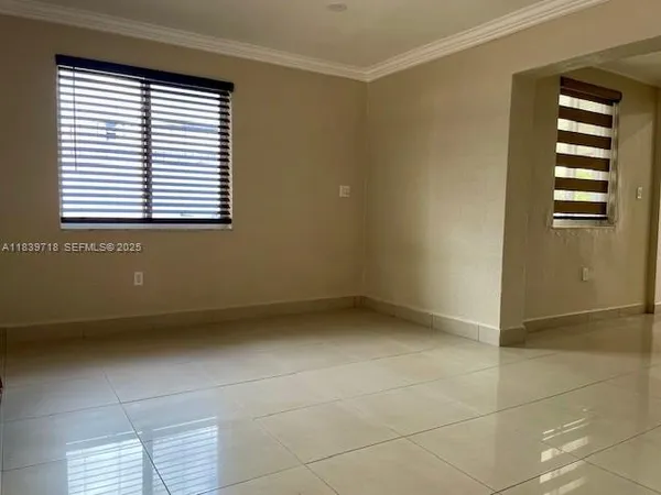 a view of an empty room with a window