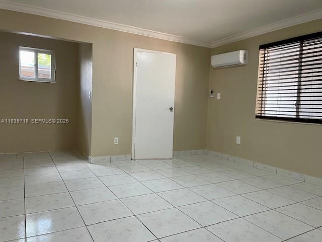 330 West 40th Place Hialeah, FL 33012 - Photo 14 of 20 an empty room with windows