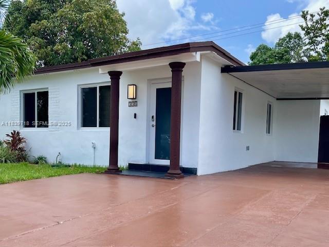 330 West 40th Place Hialeah, FL 33012 - Photo 2 of 20 a front view of a house with a yard