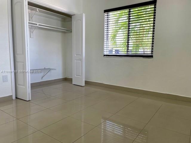 330 West 40th Place Hialeah, FL 33012 - Photo 6 of 20 a view of an empty room with a window