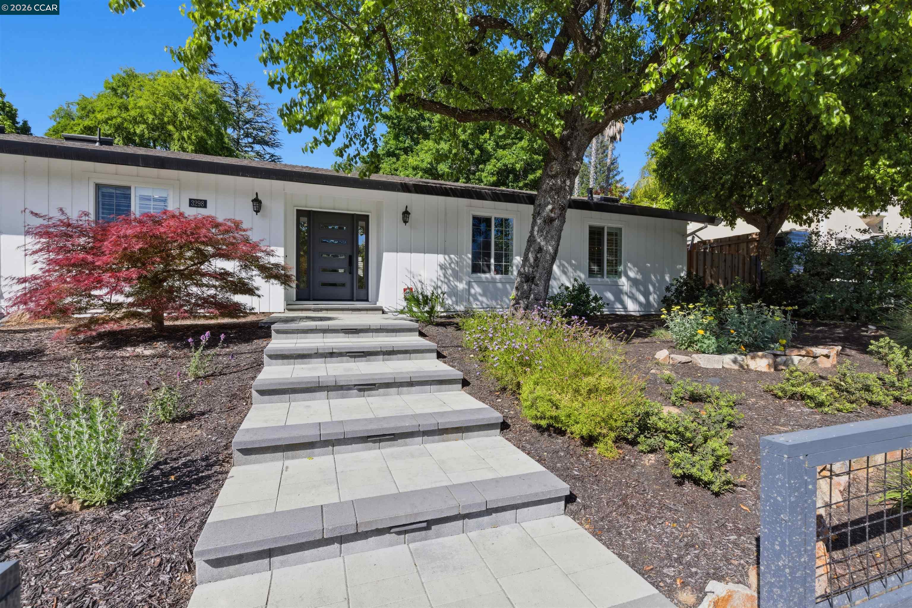 a front view of a house with garden
