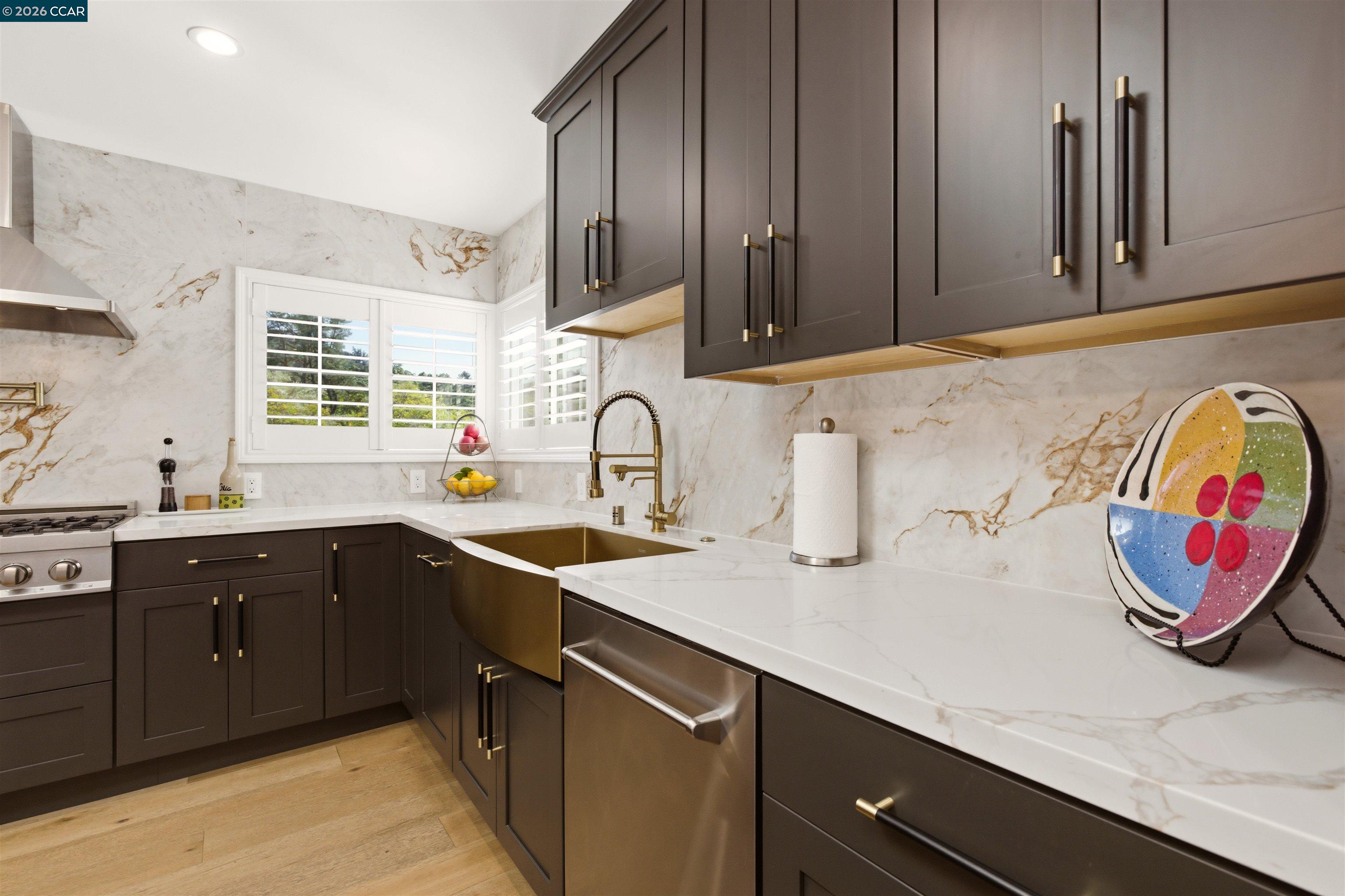 3298 Gloria Terrace Lafayette, CA 94549 - Photo 22 of 40 a kitchen with stainless steel appliances granite countertop a sink dishwasher stove and cabinets